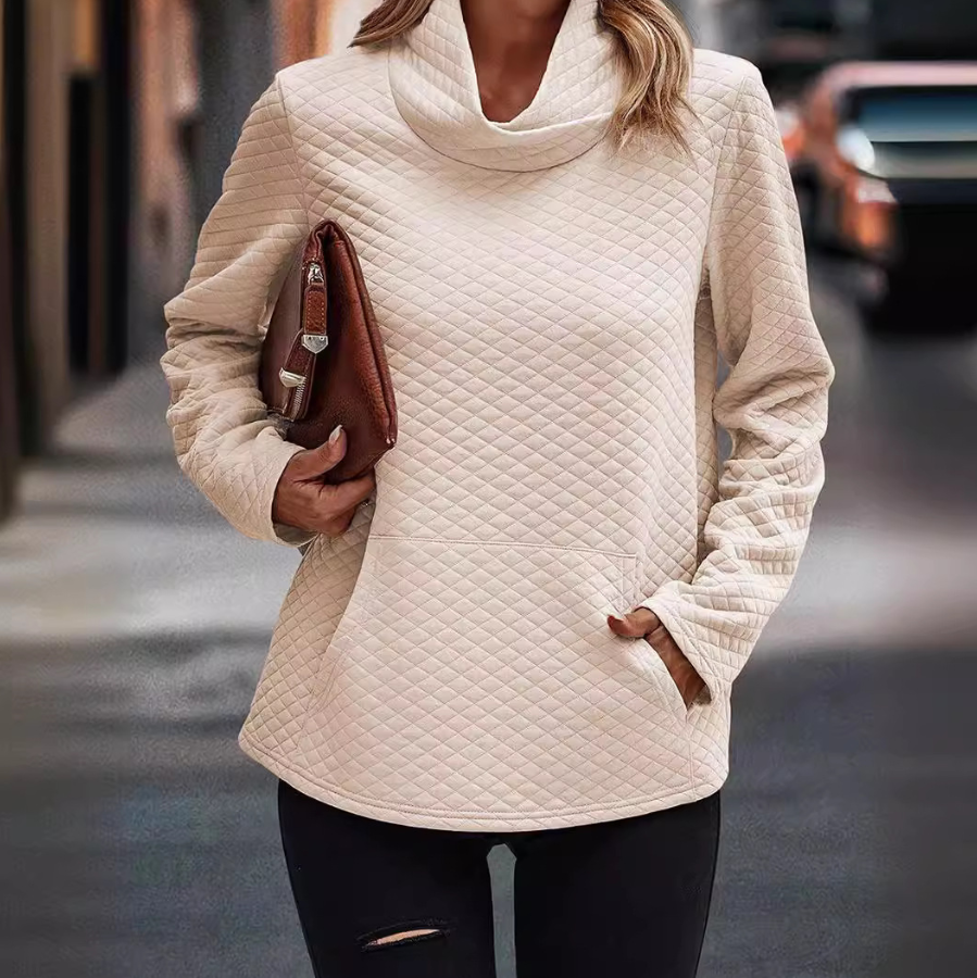 Long-sleeved top with quilted texture and raised collar